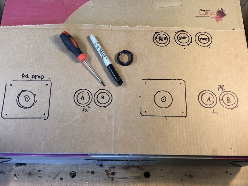 Button and joystick layout drawn on the cardboard